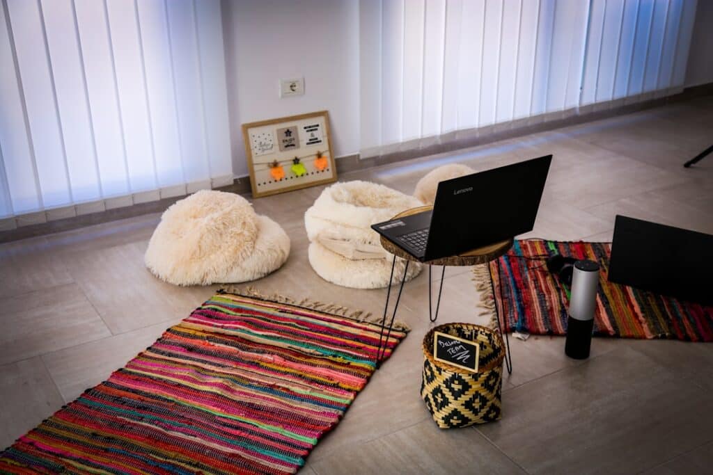Clean, modern yoga studio with natural light and mats laid out